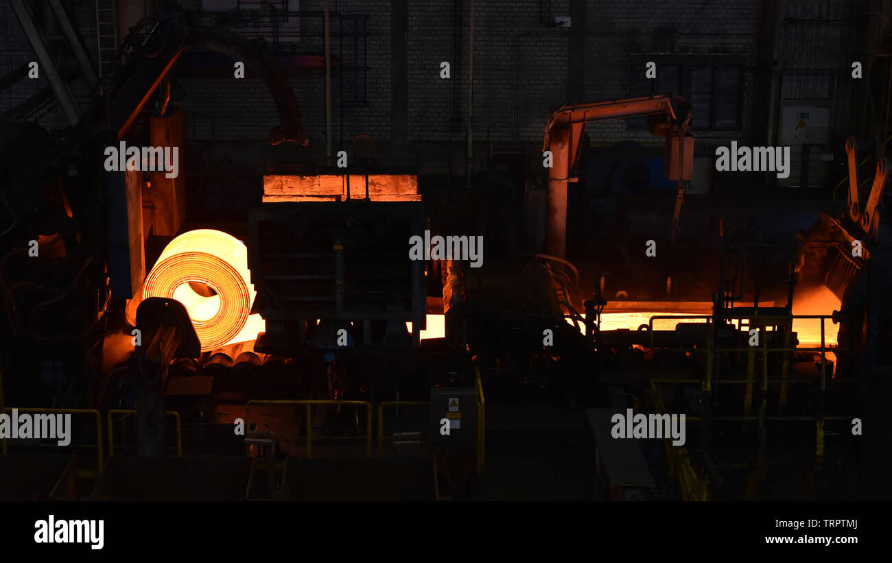 glowing roller metal in a steel mill - industrial factory for the production of sheet metal Stock Photo