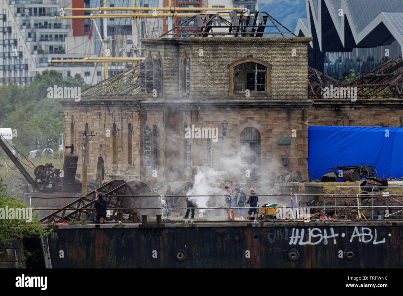 Glasgow, Scotland, UK 11th June, 2019. Smoke on the water as Steven Spielberg first world war movie “1917” began filming in the Govan graving docks on the banks of the river Clyde in the city today with pyrotechnics being tested. Credit: Gerard Ferry/ Alamy Live News Stock Photo