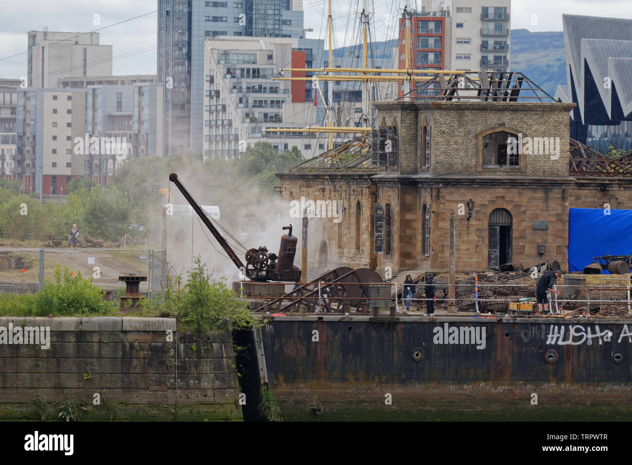 Glasgow, Scotland, UK 11th June, 2019. Smoke on the water as Steven Spielberg first world war movie “1917” began filming in the Govan graving docks on the banks of the river Clyde in the city today with pyrotechnics being tested. Credit: Gerard Ferry/ Alamy Live News Stock Photo