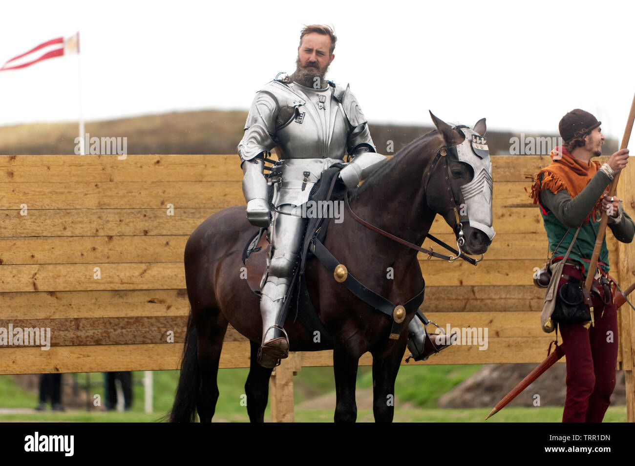 A mounted Knight in full Armour demonstrating horse riding skills
