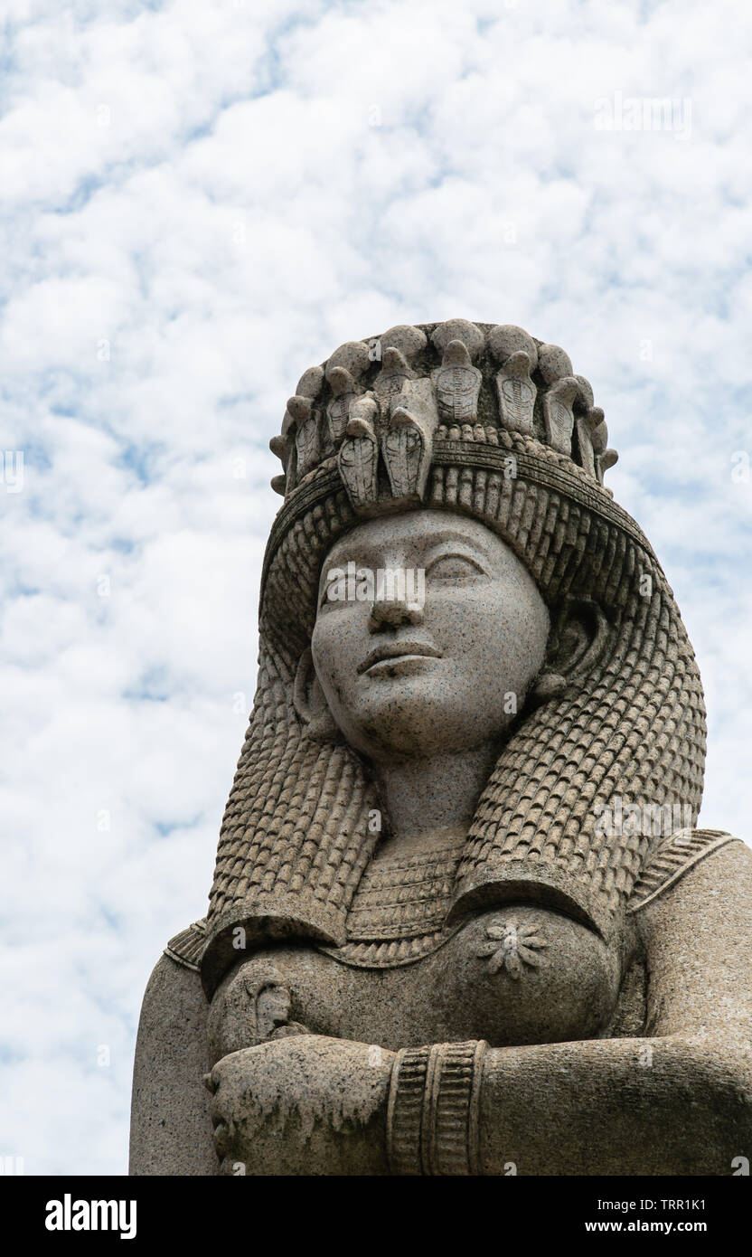 Egypt style sculpture in the cloudy sky background Stock Photo