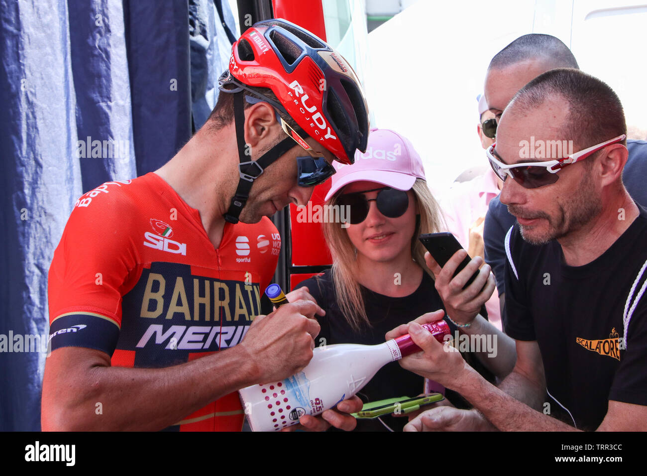 Vincenzo Nibali Italian Cyclist of sign an autograph at the start of Stage 21 of the cycling Giro d'Italia 2019 the Time Trial in Verona, Italy Stock Photo