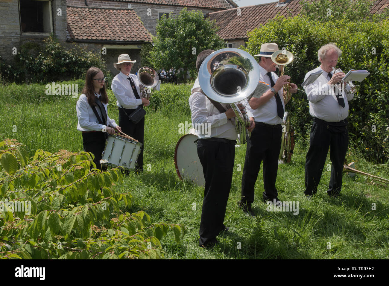 Village silver band Somerset Uk.Summer sunshine beautiful weather  2010s, playing in the garden of a farm house UK HOMER SYKES Stock Photo