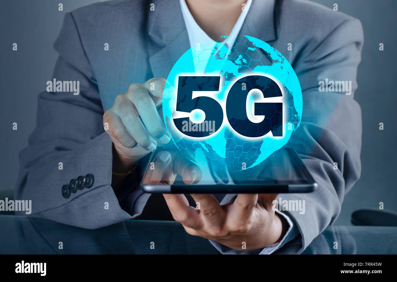 phone 5g Earth businessman connect worldwide waiter hand holding an empty digital tablet with smart and 5G network connection concept Stock Photo