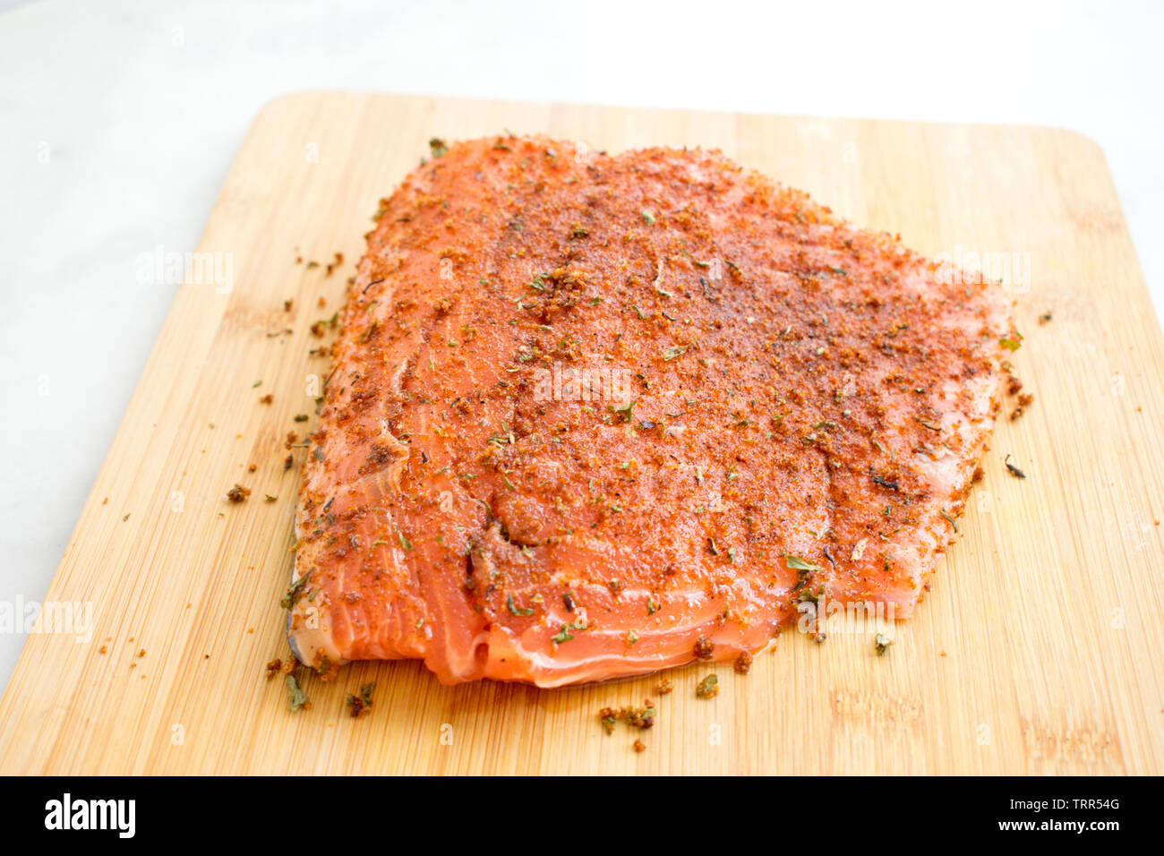 Seasoning Salmon Fillet with Jamaican Jerk Spices Stock Photo Alamy