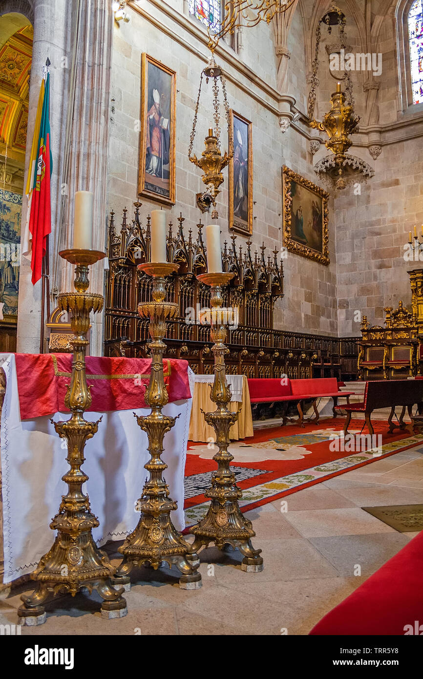 Braga, Portugal. Se de Braga Cathedral. Three tall candlesticks in main chapel altar and choir stalls. Oldest Cathedral in Portugal. 11th century Roma Stock Photo