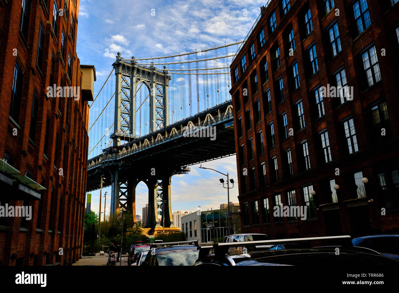Pictured is the Manhattan Bridge, Dumbo's cobblestone streets at Brooklyn, New York, USA. Stock Photo