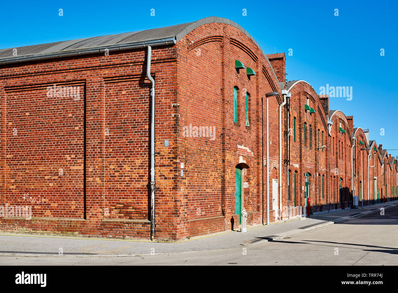 Warehouses in industrial area Stock Photo - Alamy