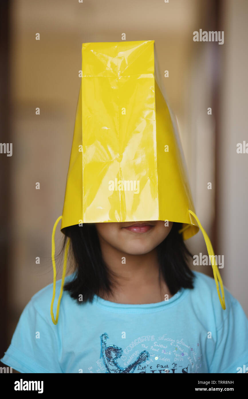 Girl with a paper bag on her head Stock Photo Alamy