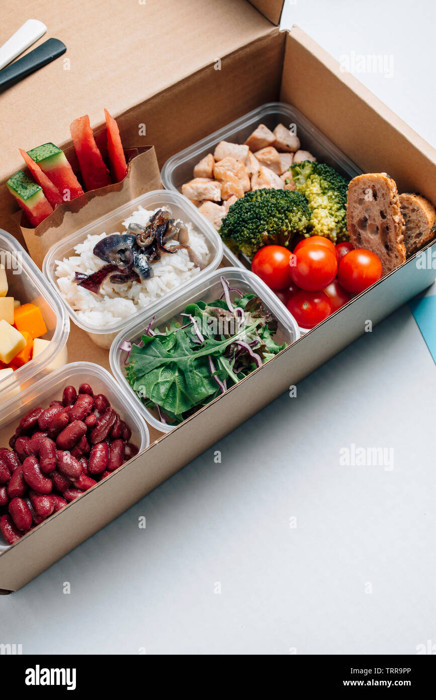 Healthy food in lunch box, minimal concept of eating at workplace