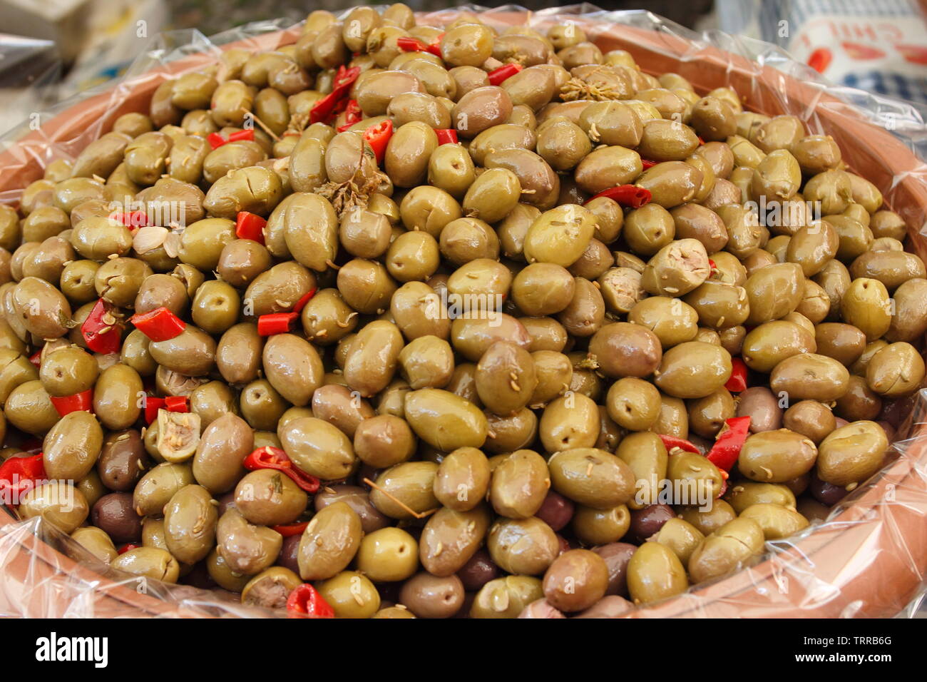 Italy Piedmont lakes area Orta San Giulio Lago d' Giulio Italian Alps green olives peppers and olives for sale in Wednesday market Stock Photo