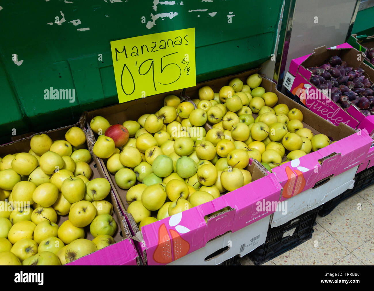 Golden Delicious Apples (Manzana is Spanish for Apple) on market stall