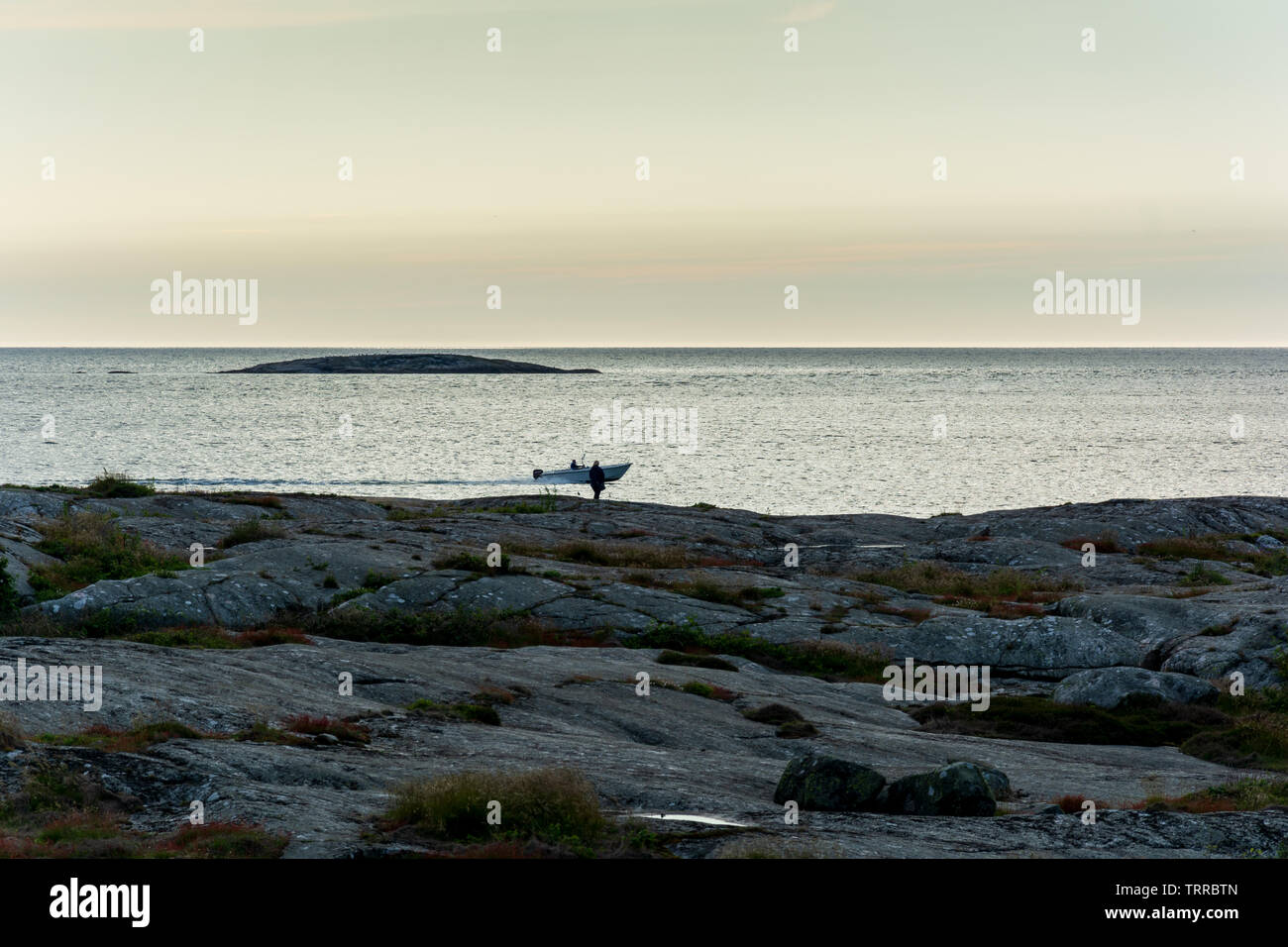 silhouette of tourist witnessing sunset near foto island gothenburg ...