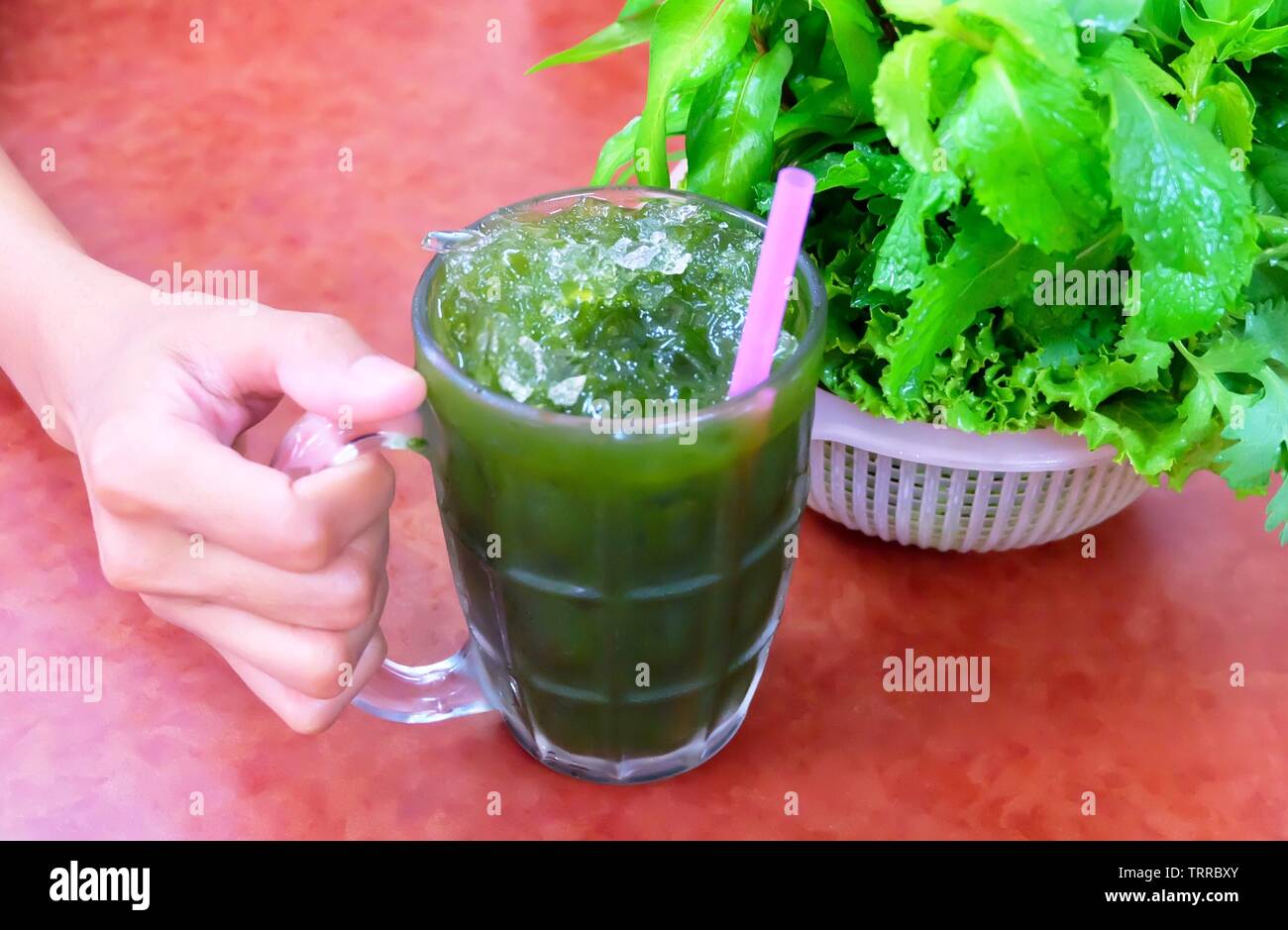Hand Holding Glass Of Fresh Green Medicinal Centella Asiatica Asiatic Pennywort Thankuni Or Gotu Kola Juice Alternative Medicine For Arthritis And Stock Photo Alamy