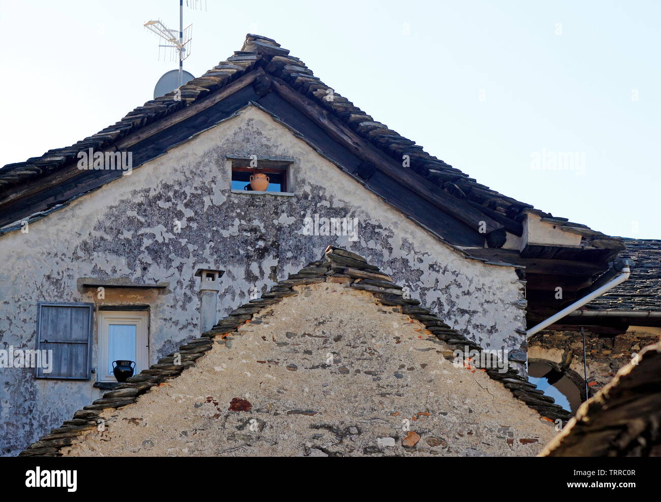 Italy Piedmont lakes area Orta San Giulio Lago d' Giulio Italian Alps roof peaks rooftop stone roof buildings Stock Photo