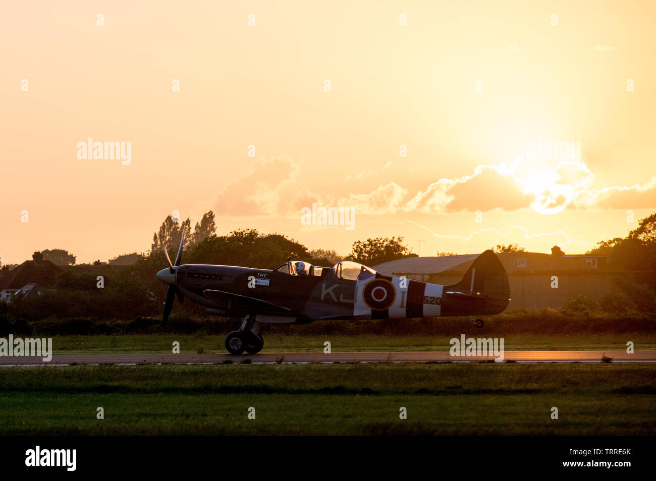 Spitfire SM520  taking off in the sunset Stock Photo
