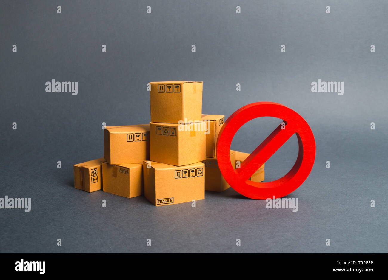 Many cardboard boxes and a red symbol NO. Embargo, trade wars. Restriction on the importation of goods, proprietary for business. Inability to sell pr Stock Photo