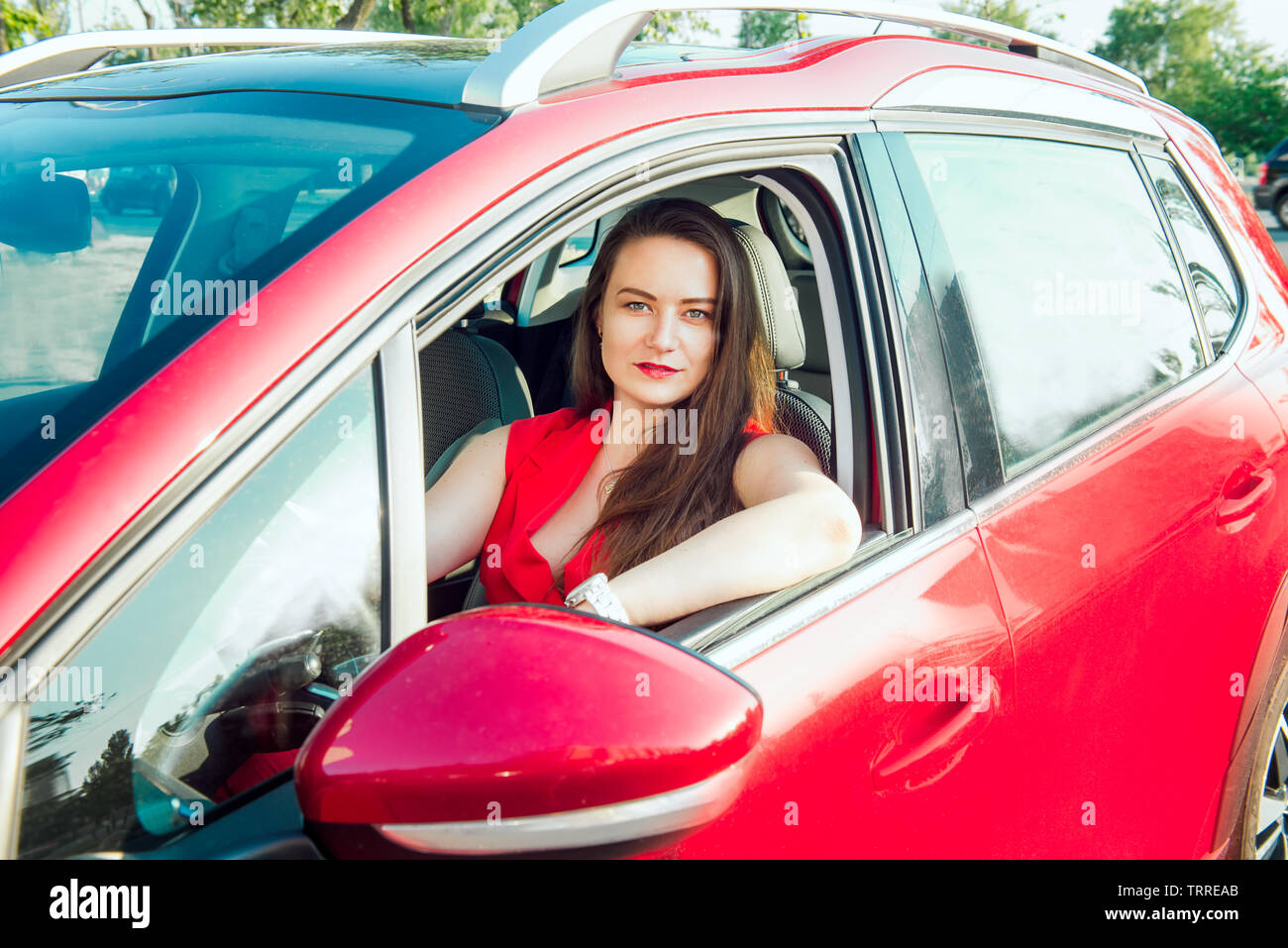 Woman sitting behind steering wheel hi-res stock photography and images ...