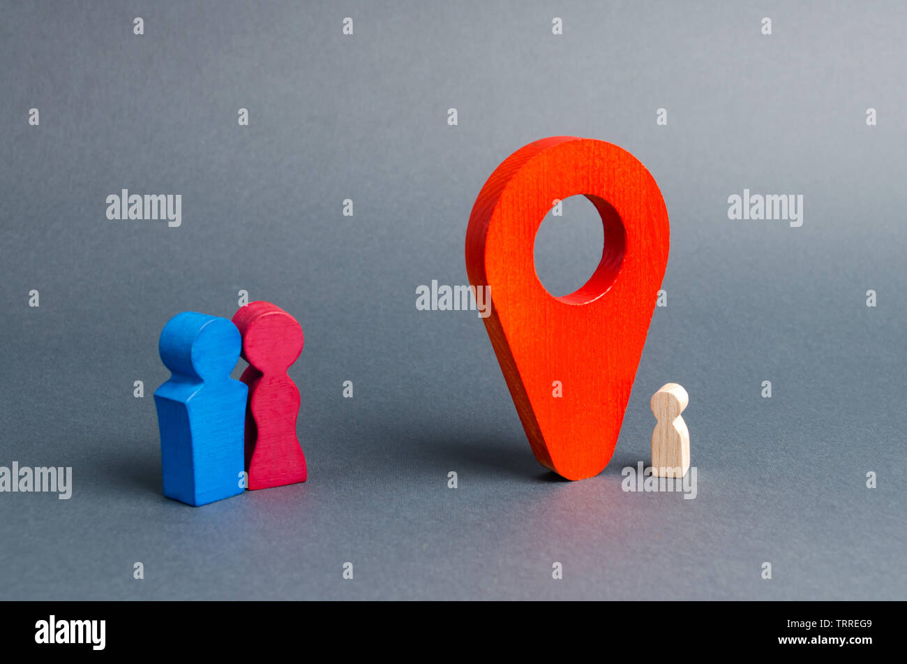 Parents in search of a lost child or adoption of a child near the location marker. The concept of finding a child, the adoption of children. Mother lo Stock Photo