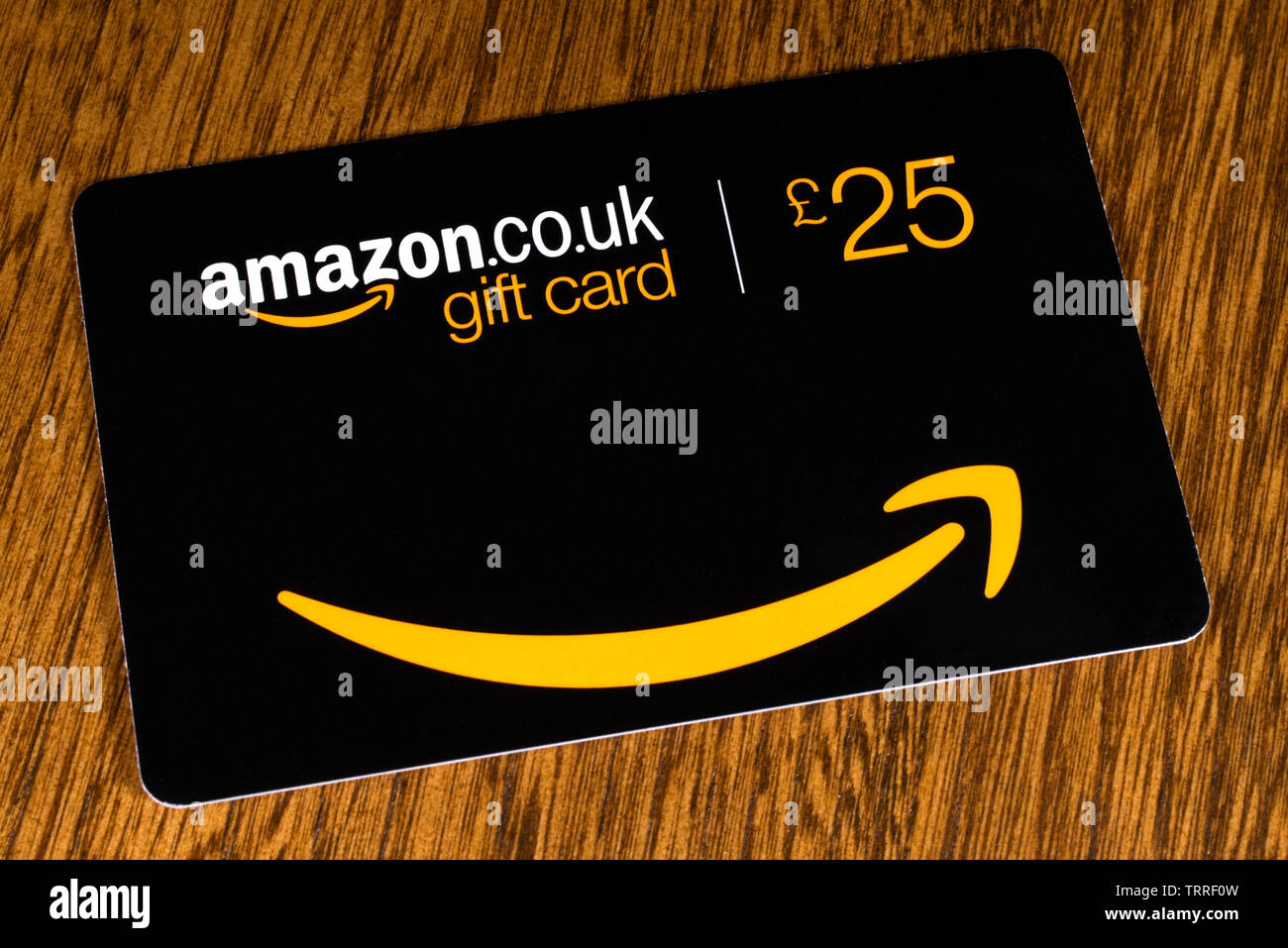 London, UK - June 11th 2019: An Amazon gift card for £25 pictured on a  wooden surface Stock Photo - Alamy