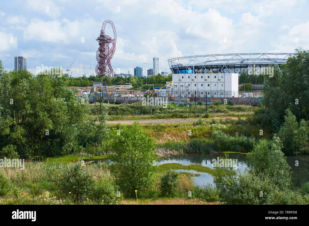 New construction near the London Stadium in the London Olympic Park, with marshland in the foreground Stock Photo