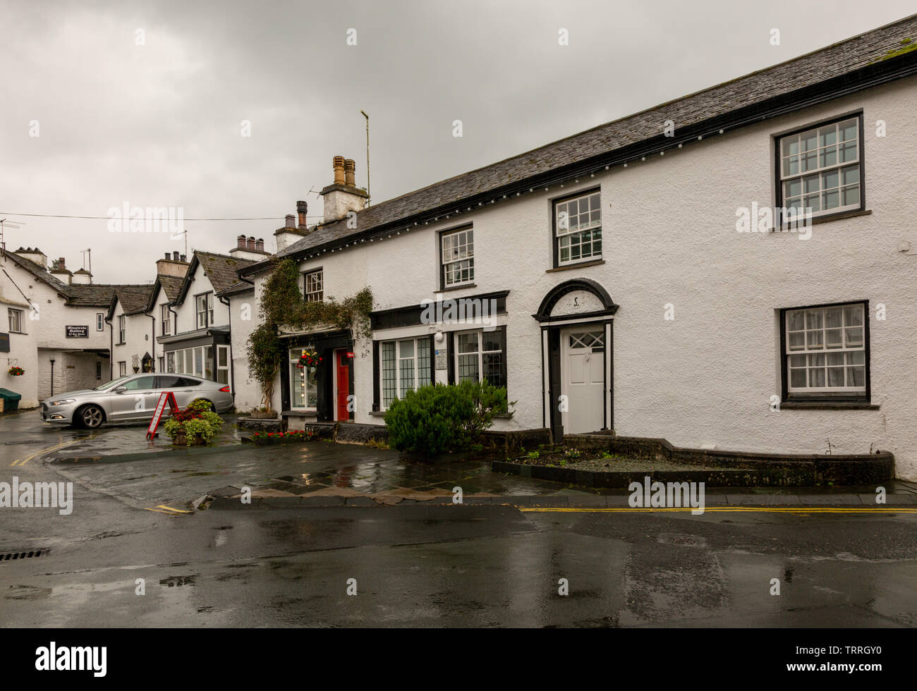 Street in Hawkshead, Cumbria, UK, in the rain in summer Stock Photo