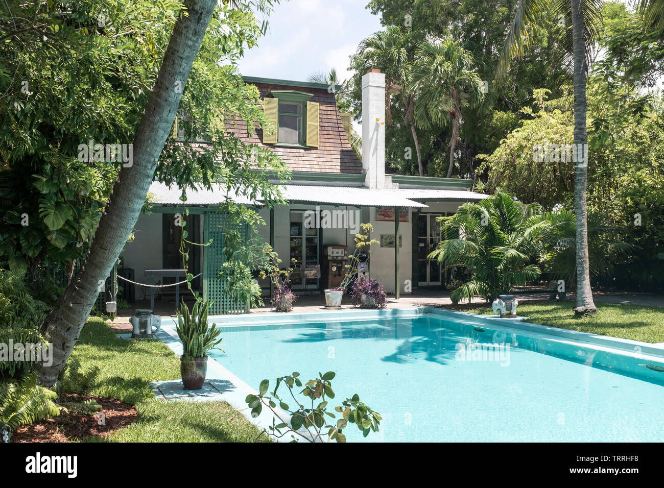A view of the pool, the first in Key West and the carriage house where