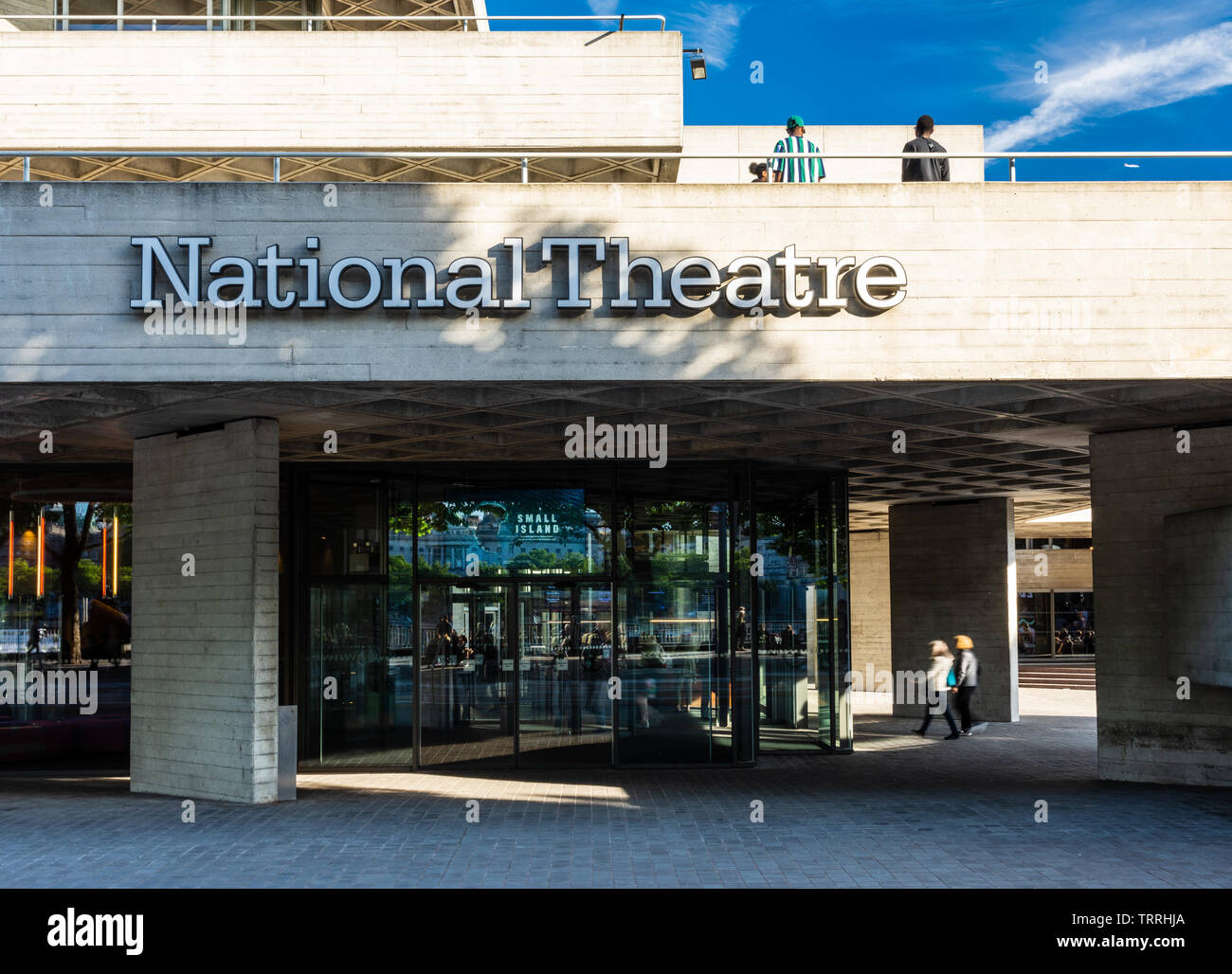 London, England, UK - May 31, 2019: People walk on the concrete terraces of the National Theatre in London's South Bank neighbourhood. Stock Photo