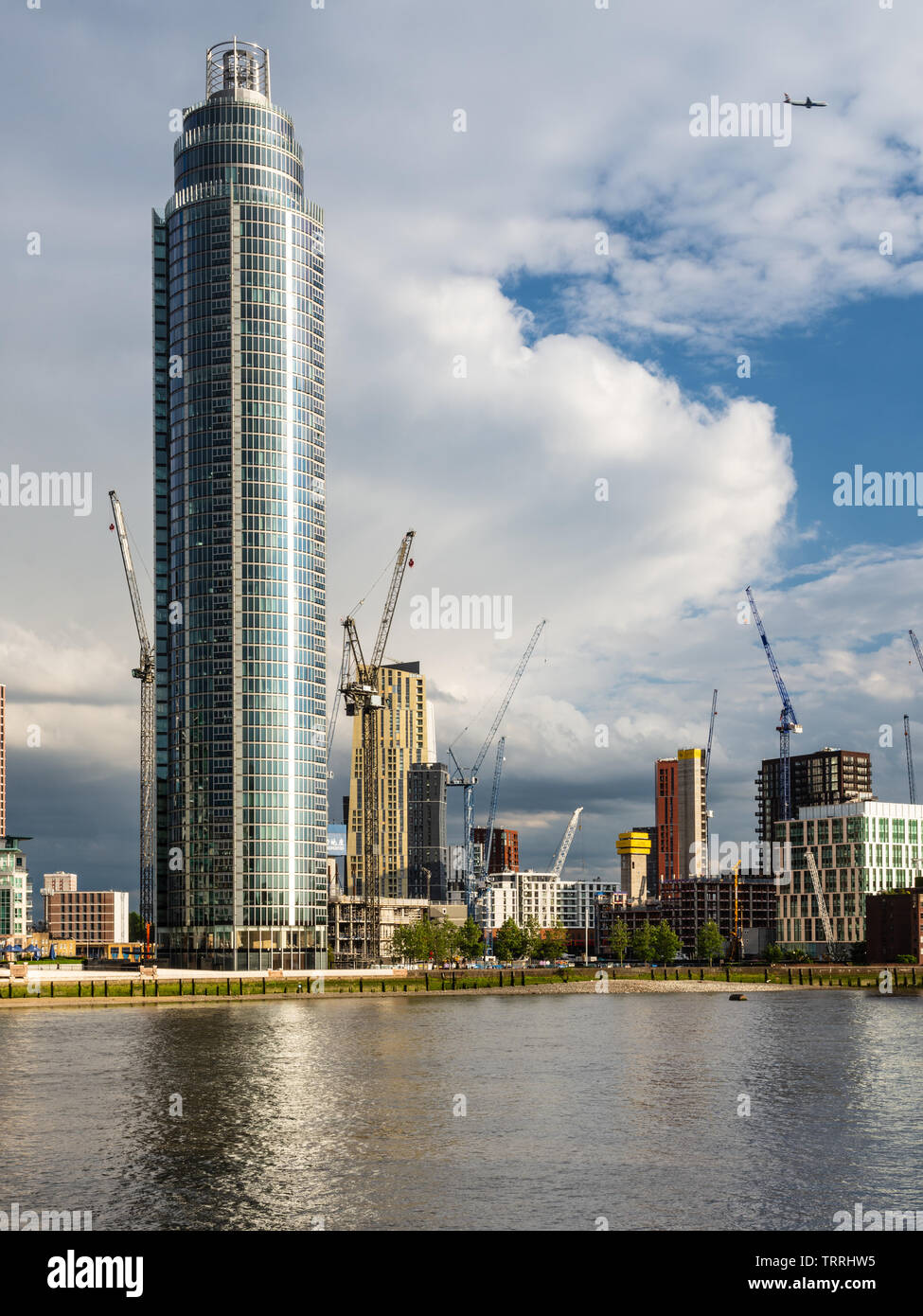 London, England, UK - May 28, 2019: The St George's Wharf skyscraper and other new build apartment buildings stand among construction cranes in the Ni Stock Photo
