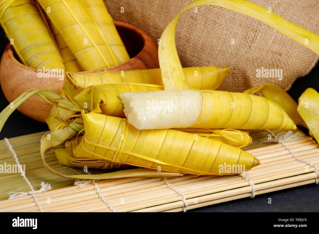 Suman sa Ibos, a traditional sticky rice cake wrapped in buli leaves Stock Photo