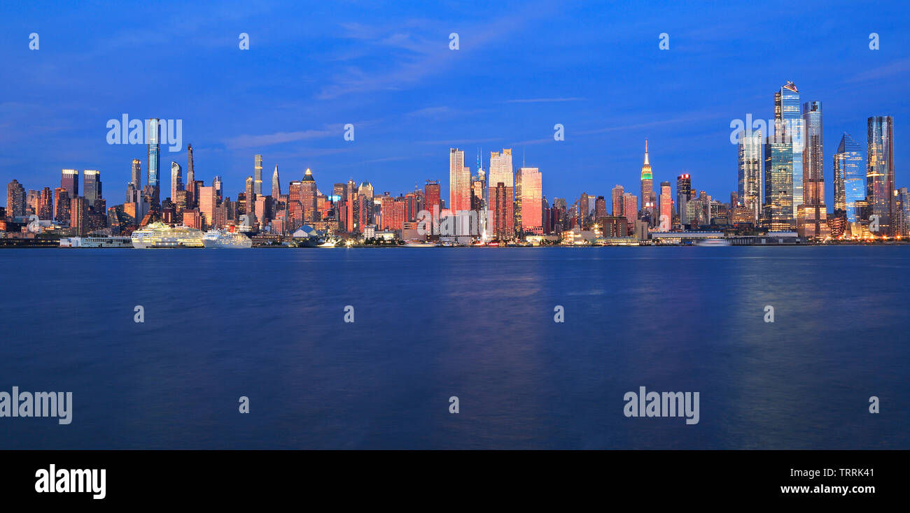 New York City skyline at dusk reflected in Hudson River, USA Stock ...