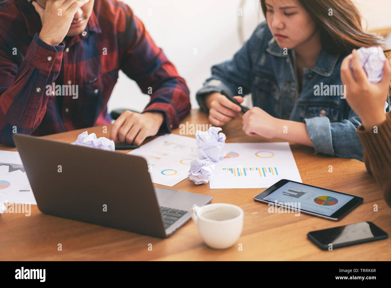 Three businessman get stressed while having a problem in business meeting Stock Photo