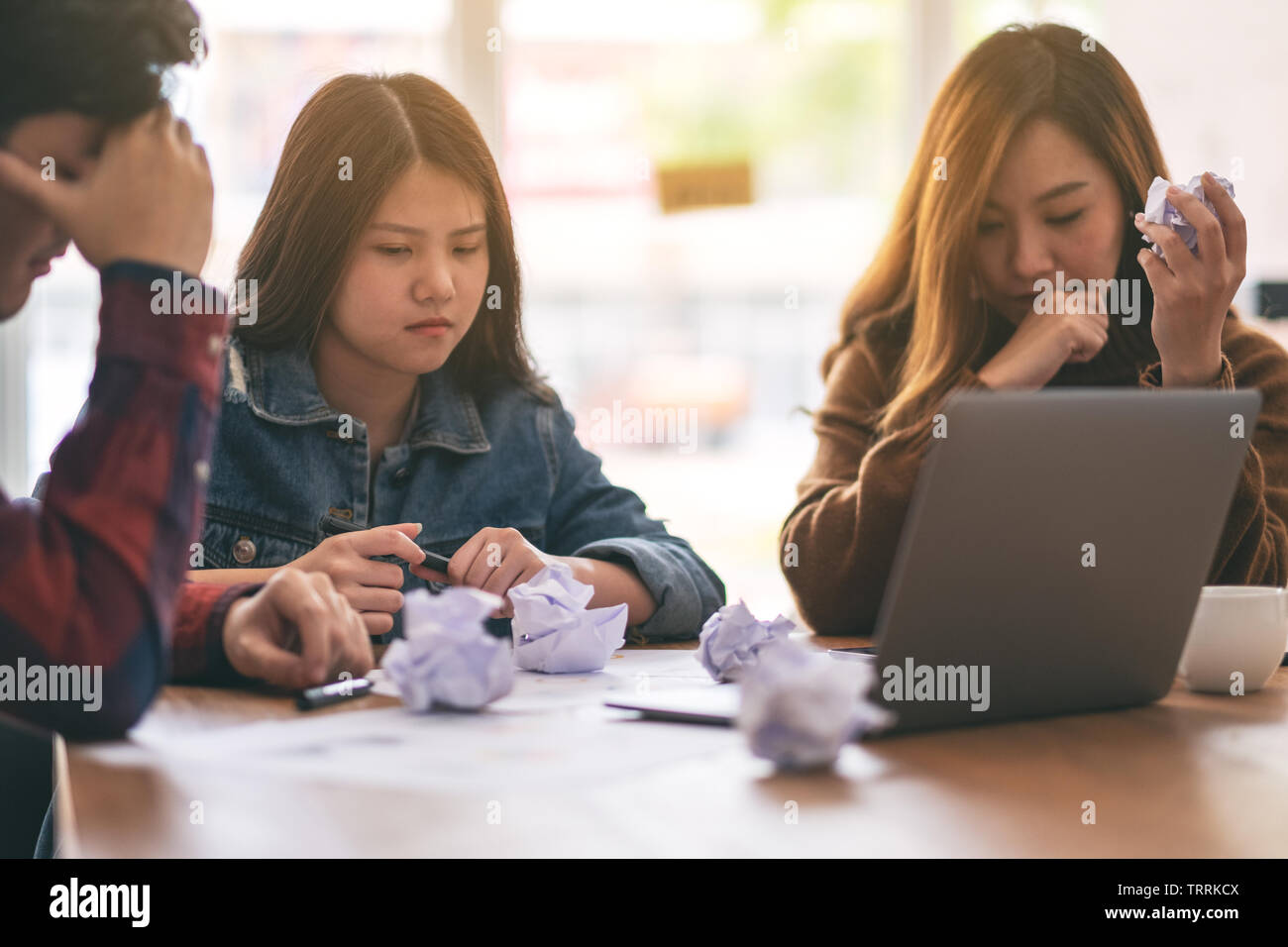 Three businessman get stressed while having a problem in business meeting Stock Photo