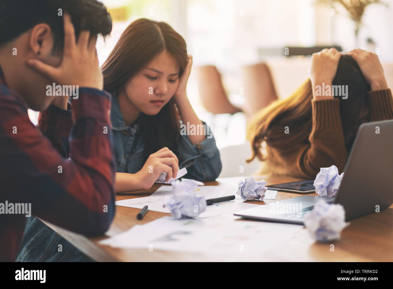 Three businessman get stressed while having a problem in business meeting Stock Photo