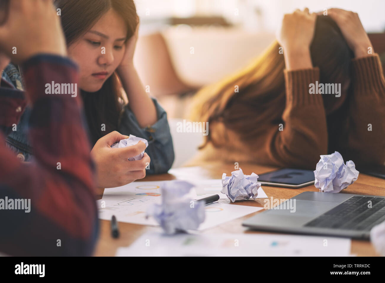 Three businessman get stressed while having a problem in business meeting Stock Photo