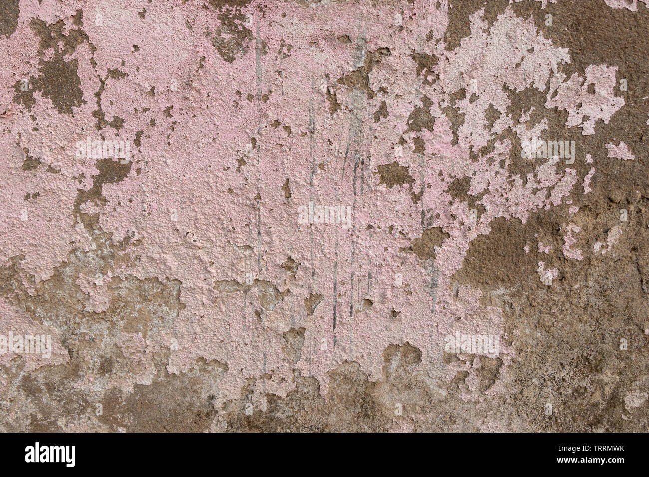 Concrete old wall plaster and paint peeled off due to mosture and aged, texture or background Stock Photo
