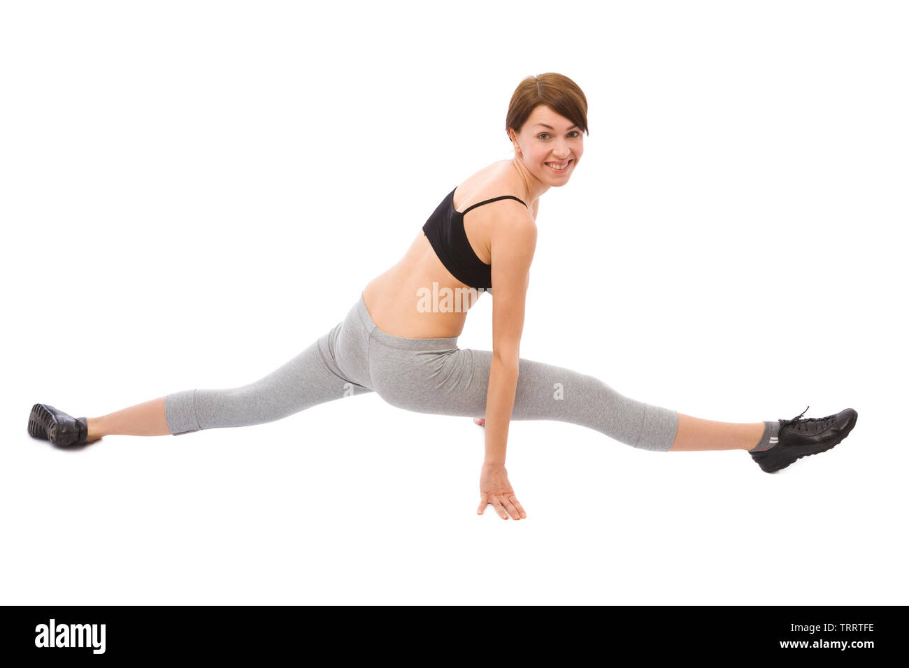 Beautiful girl doing karate exercise on white, space for messages Stock Photo
