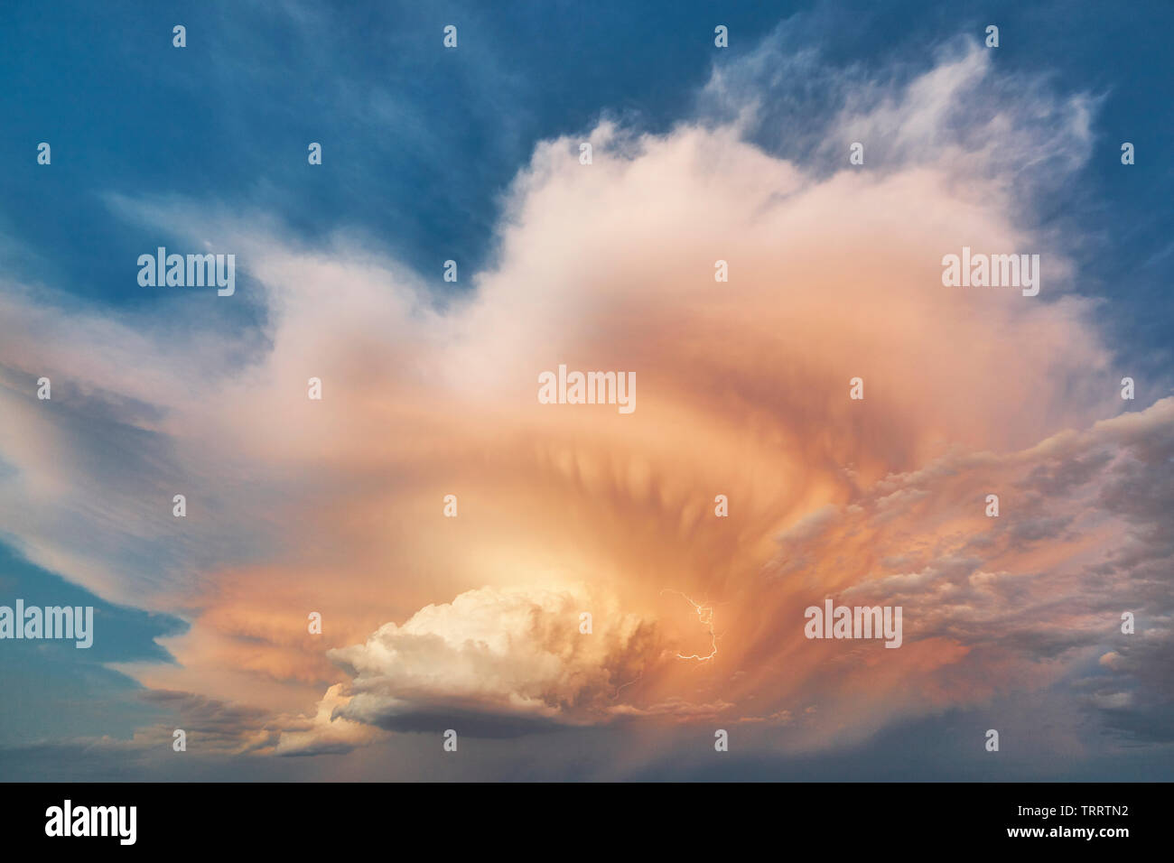 Cloudy stormy dramatic sky with lightning strike. Thunder cloudscape. Meteorology Stock Photo