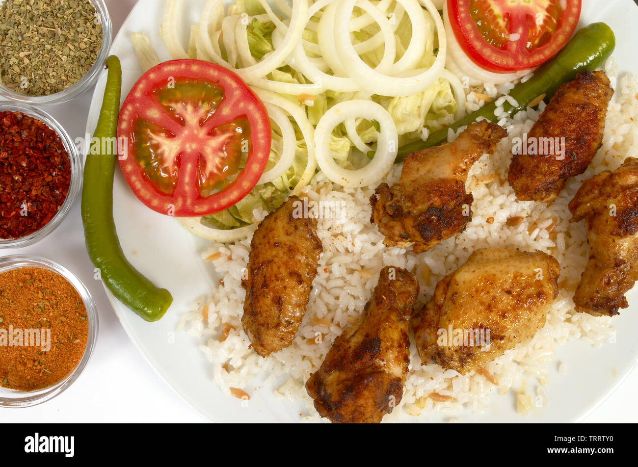 Chicken wings with rice and salads Stock Photo Alamy