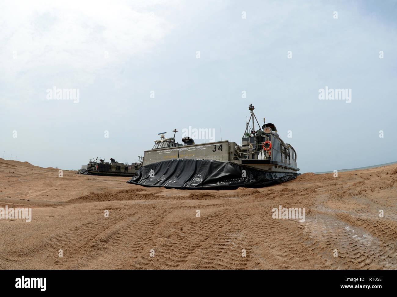 190609-N-WU565-240 - CAMP LEMONNIER, Djibouti - Two Landing Craft Air Cushion (LCAC) attached to the San Antonio-class amphibious transport dock ship USS Arlington (LPD-24), conducts a systems check after making landfall at Red Beach on base, June 9, 2019. The landing exercise is a requirement to certify the beach, demonstrate capabilities and readiness. Camp Lemonnier is an operational installation that enables U.S., allied and partner nation forces to be where and when they are needed to ensure security in Europe, Africa and Southwest Asia. (U.S. Navy photo by Mass Communication Specialist 2 Stock Photo