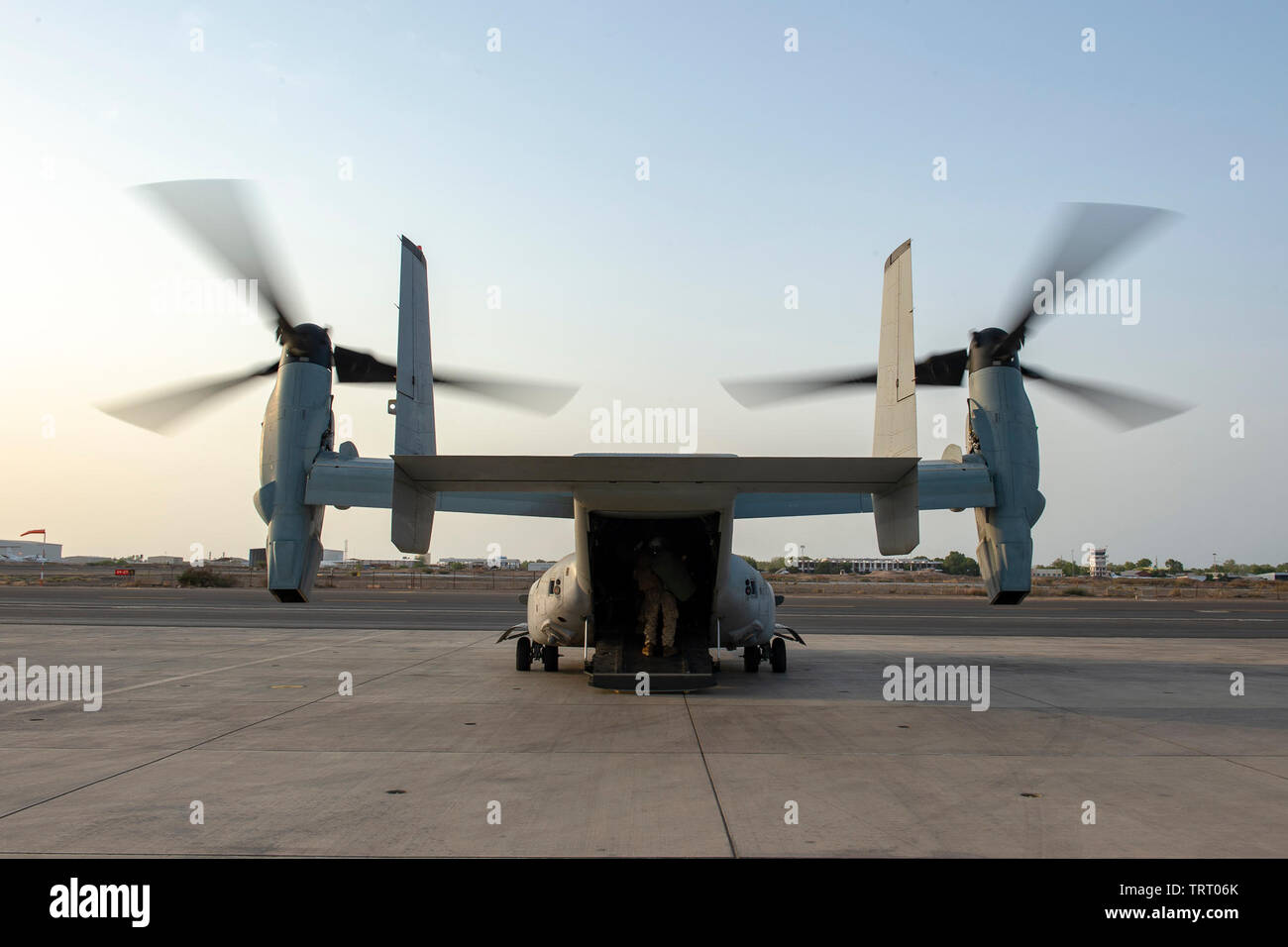 A U.S. Marine Corps MV-22B Osprey with Marine Medium Tiltrotor Squadron 264 (Reinforced), Marine Aircraft Group (MAG) 26, 2nd Marine Aircraft Wing (MAW), 22nd Marine Expeditionary Unit (MEU) attached to the San Antonio-class amphibious transport dock ship USS Arlington (LPD 24) arrives on the flight line during passenger transfer operations at Camp Lemonnier, Djibouti, June 7, 2019. Camp Lemonnier is an operationally-focused shore installation that enables U.S., allied and partner nation forces to be where and when they are needed to ensure security and stability in Europe, Africa and Southwes Stock Photo
