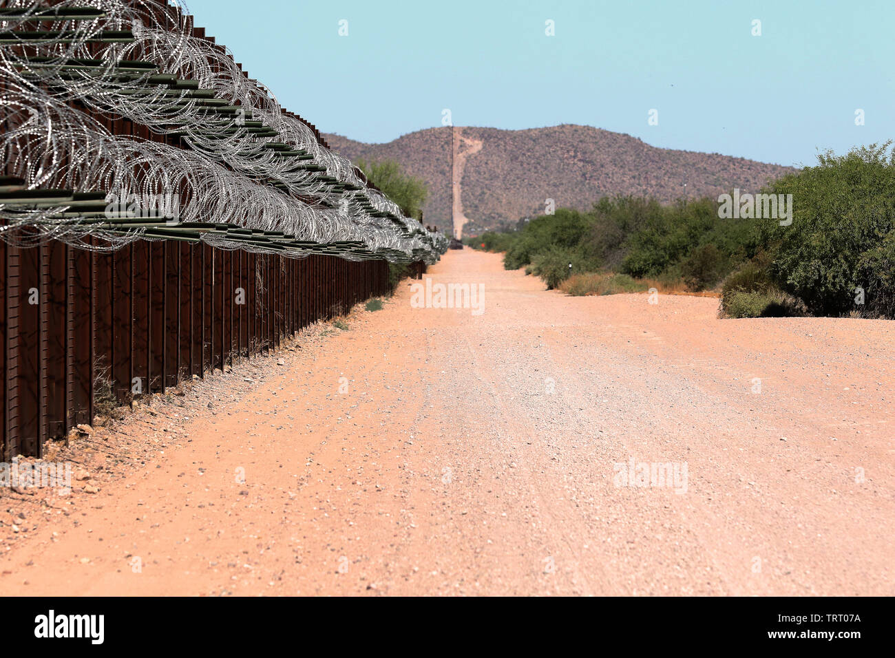 A quality assurance (QA) specialist with Task Force Barrier visited a portion of the Tucson Sector to do reconnaissance of the existing barrier June 8, 2019. The QA noted the presence of flash flood gates, access gates, harsh conditions, areas where the barrier had been cut and repaired, and steep grades, making some areas difficult to reach. Stock Photo
