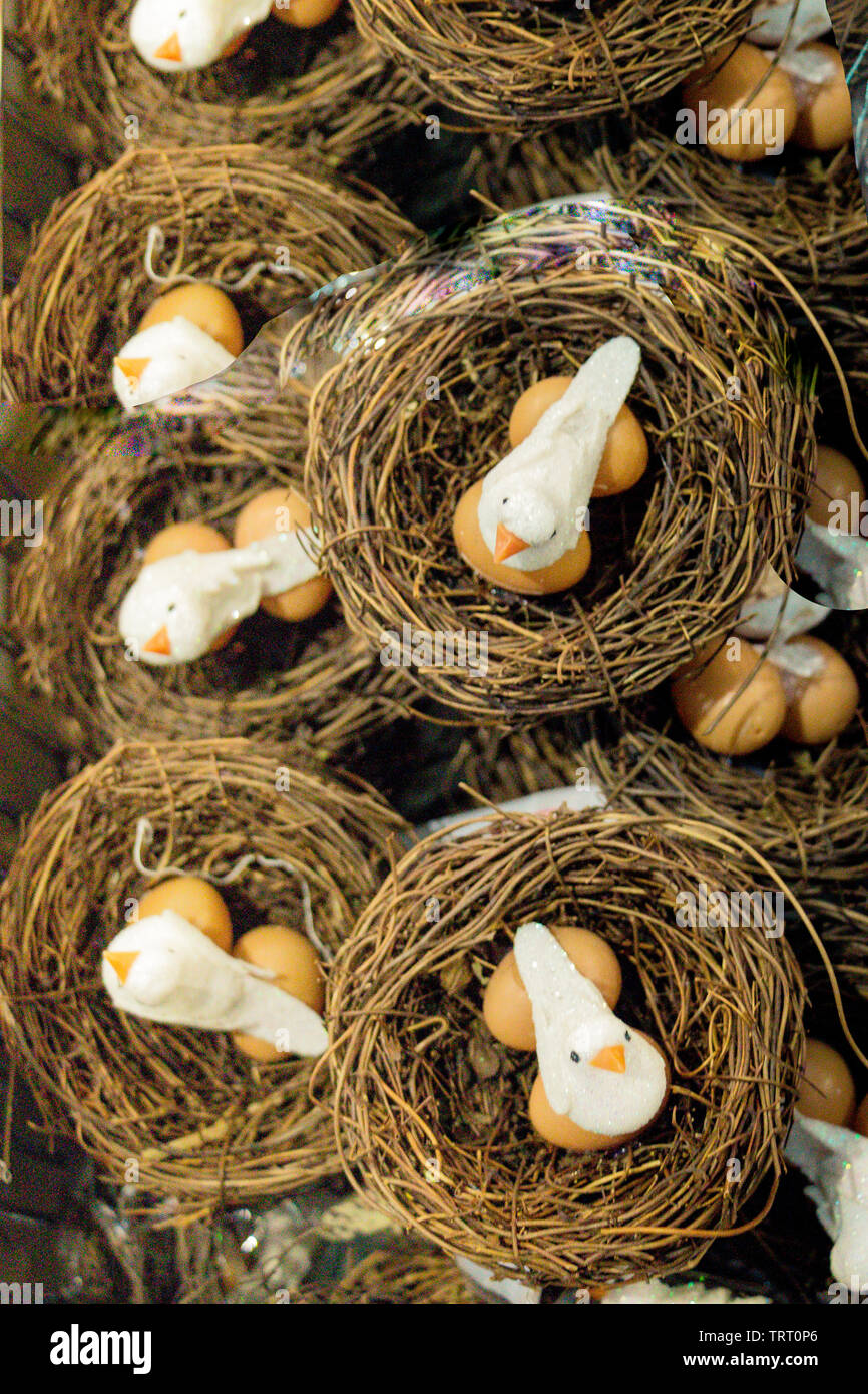 The small artificial bird nest with fake eggs in it Stock Photo Alamy