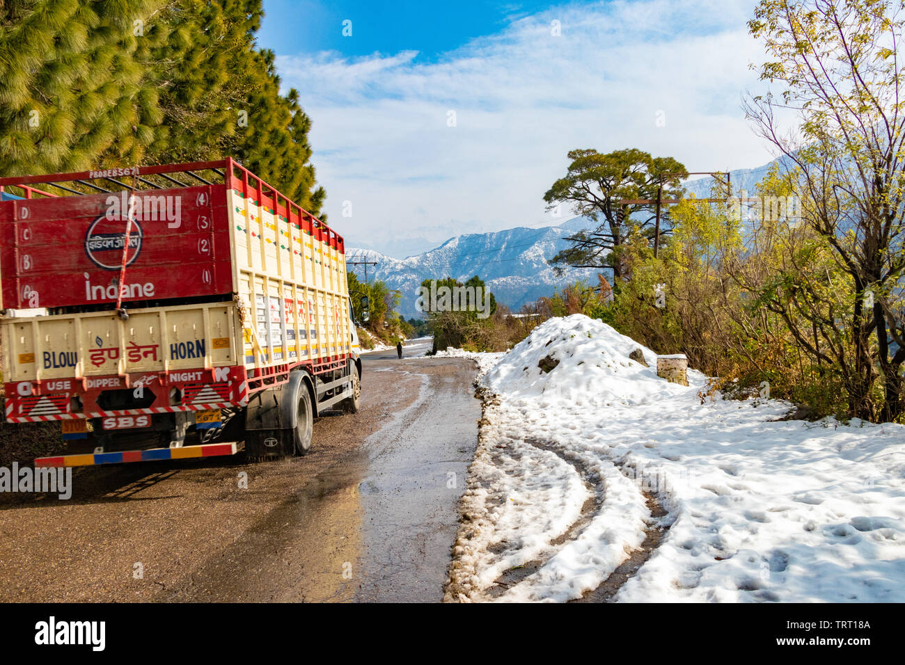 Banikhet, Dalhousie, Himachal Pradesh, India - January 2019. After consequences of heavy snowfall, Indian oil LPG truck on the road. Stock Photo