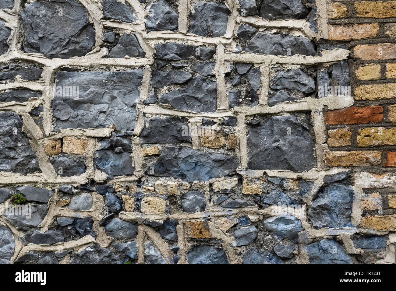 Wall detail consisting of brick and grey Carboniferous limestone, the predominant rock type in the Irish Midlands, Birr, County Offaly, Ireland Stock Photo