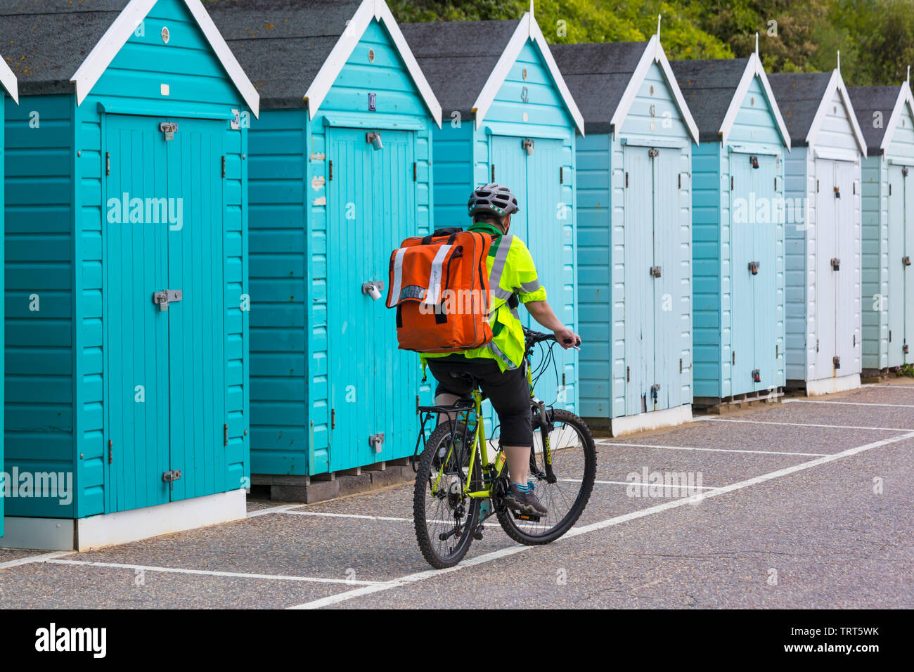 Man cycling along bournemouth promenade hires stock photography and