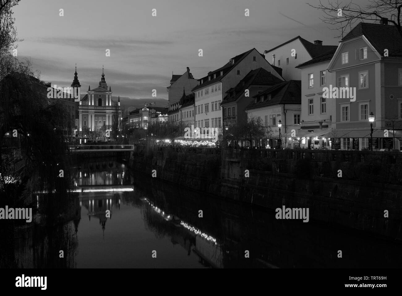 The Franciscan Church of the Annunciation and Ljubljanica River at dusk, Ljubljana city, Slovenia, Europe Stock Photo