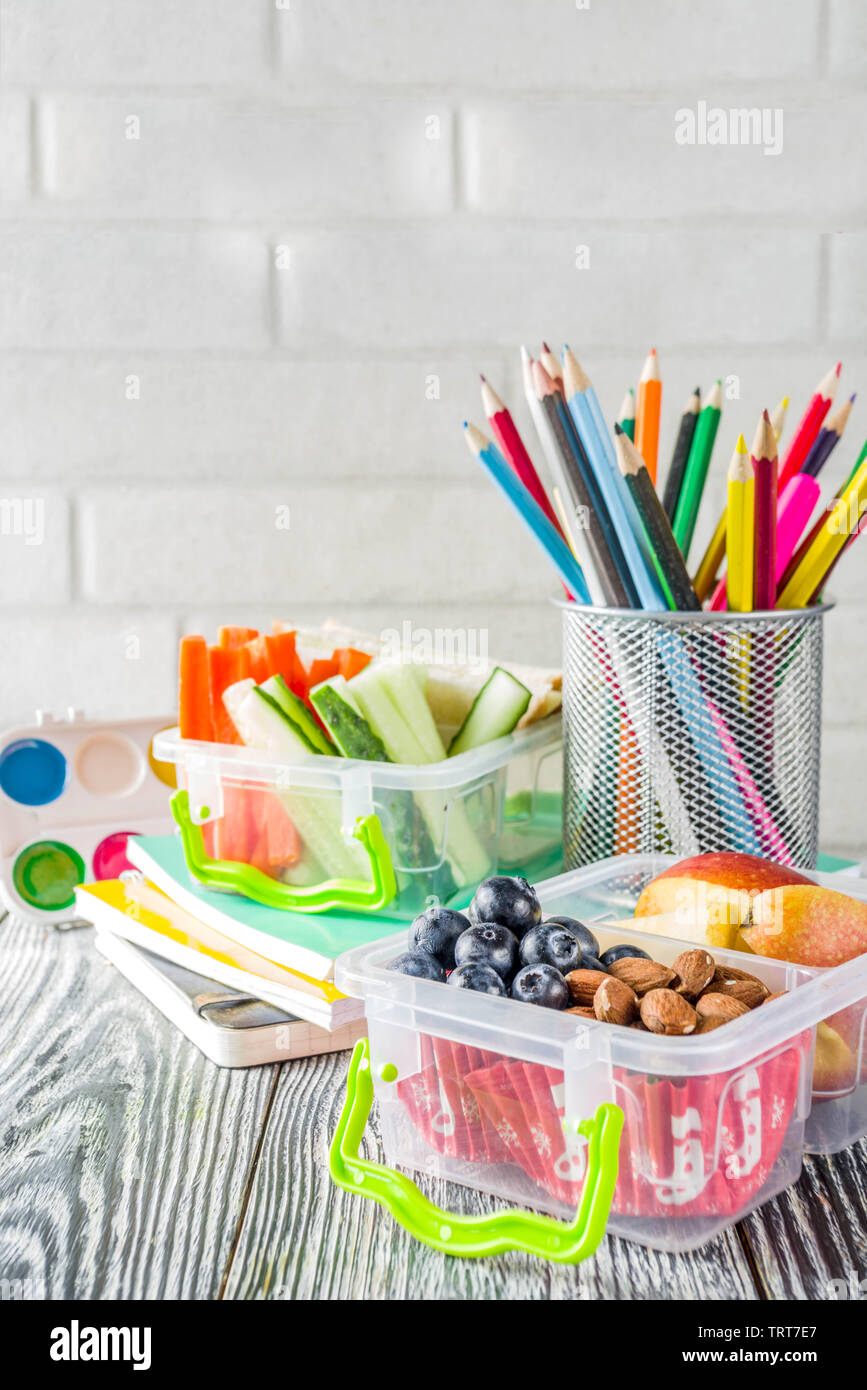 Healthy school lunch box. Kid's lunch box with sandwiches, fruit
