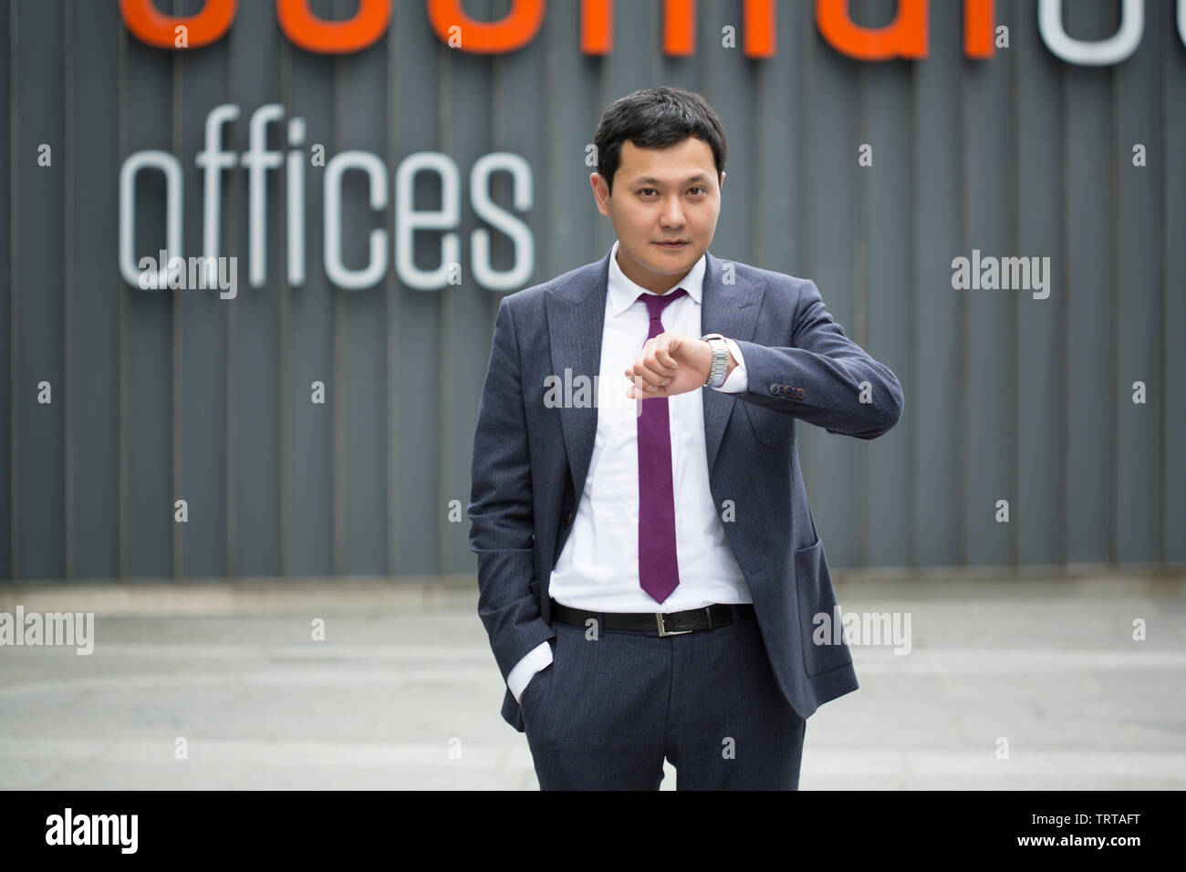 Asian businessman in black suit Stock Photo - Alamy