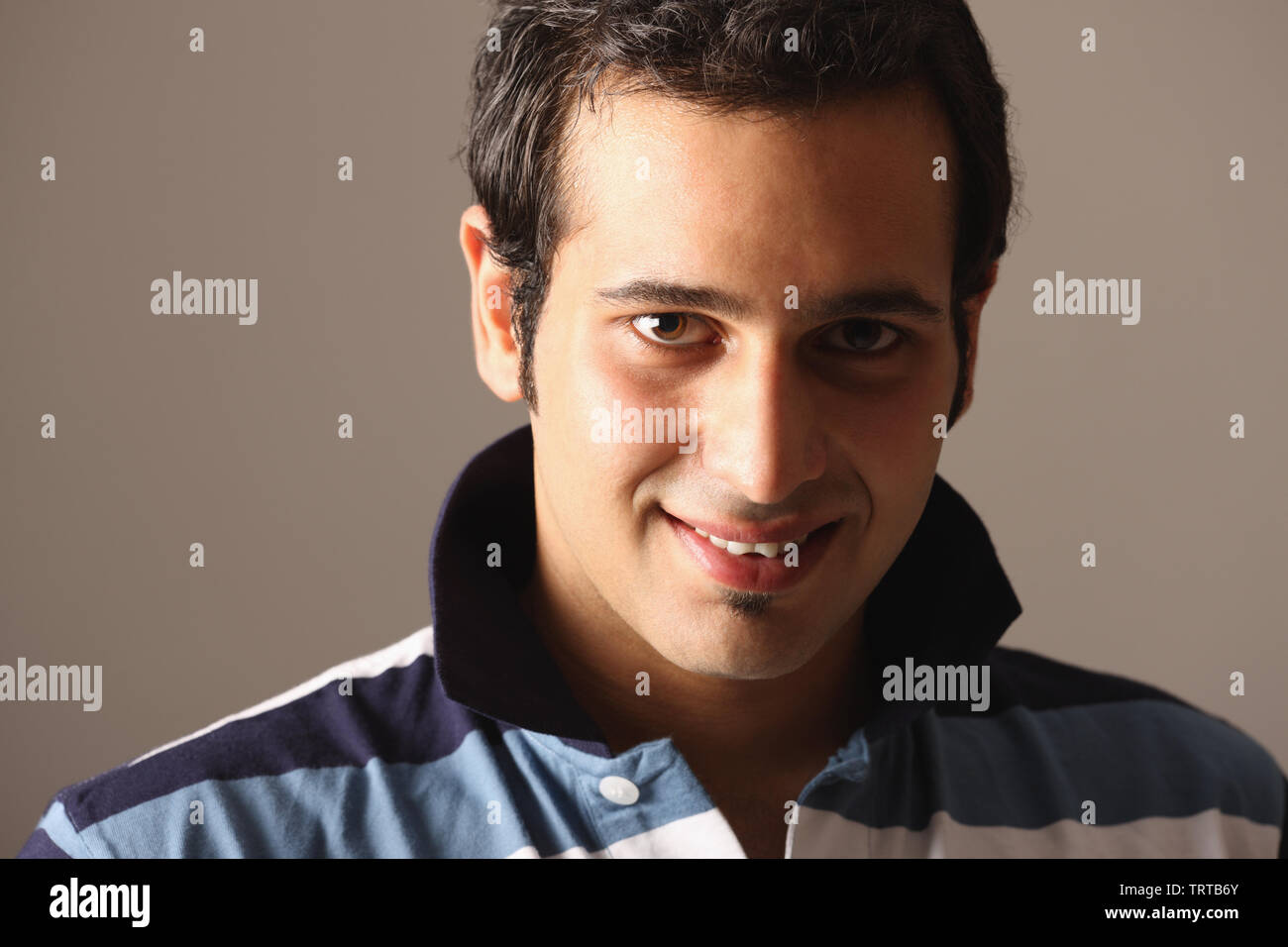 Portrait of a young man smiling Stock Photo - Alamy